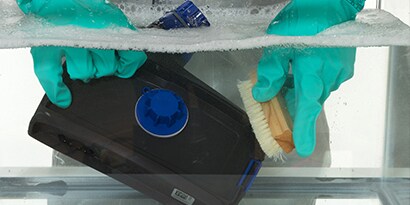 PAPR submersed in water to be cleaned
