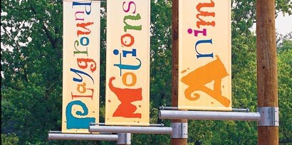 Three wayfinding signs made with 3M graphic films
