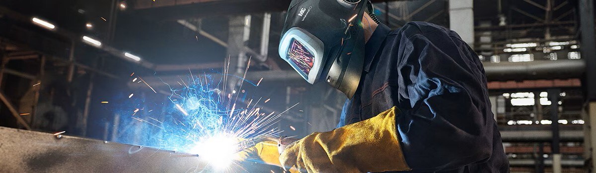 worker with welding PPE like PAPR
